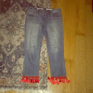 Anthropology jeans with red tassels
